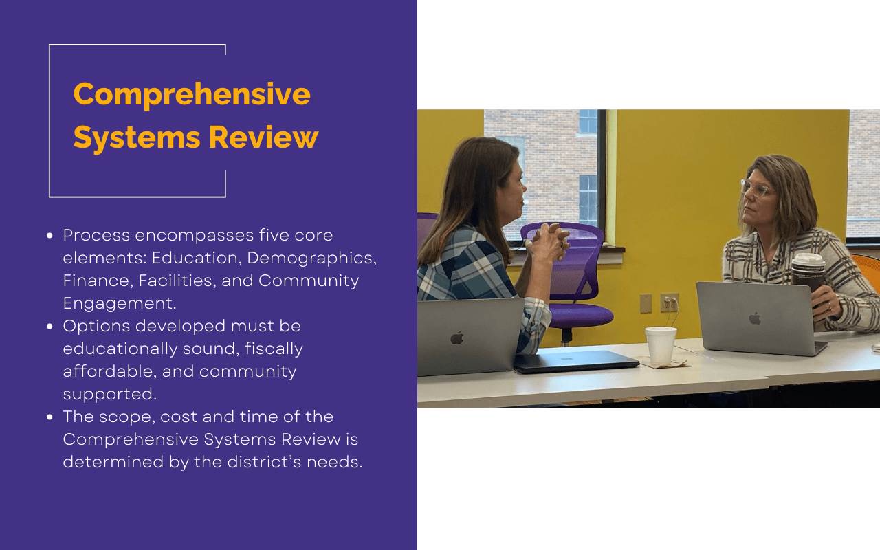Two women sitting at a table talking