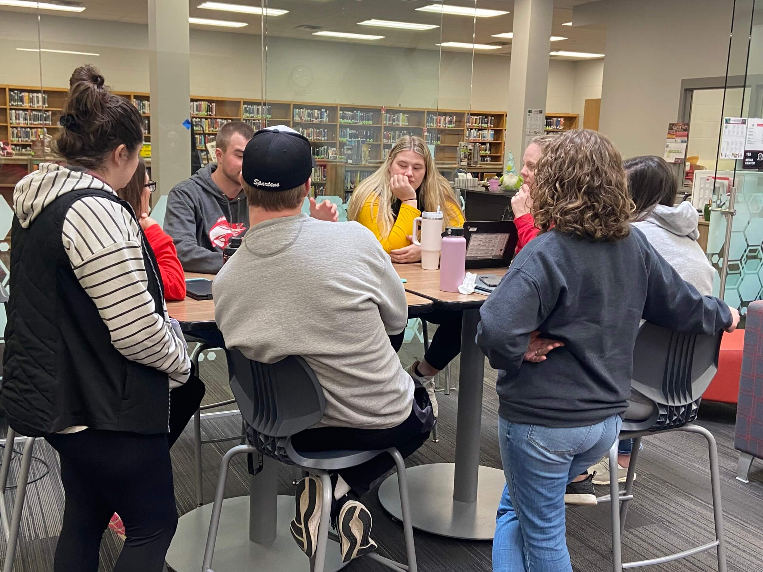 Group a teachers talking at a table