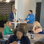 Two men talking at a table