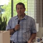 Man speaking into a mircrophone